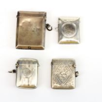 A group of four hallmarked silver vesta cases Largest. 5cm.
