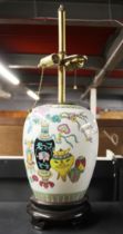 A Chinese hand painted porcelain jar mounted as a table lamp base, H. 62cm.