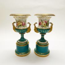 A pair of fine 19thC porcelain urns H. 32cm. (A/F hairline to interior of base)