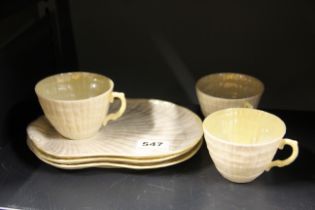 Three Belleek porcelain tv cups and saucers.