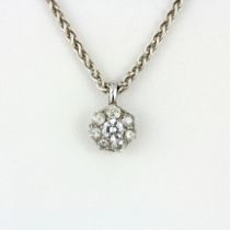 A white metal diamond set cluster pendant, center stones approx. 0.40ct, estimated approx. 1ct