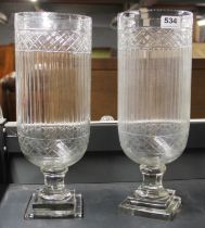 A pair of cut glass storm lanterns/vases, H. 40cm.