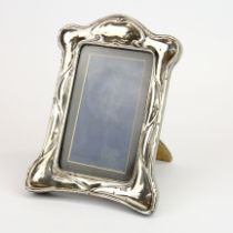 A hallmarked Art Nouveau silver photo frame, H. 19cm.