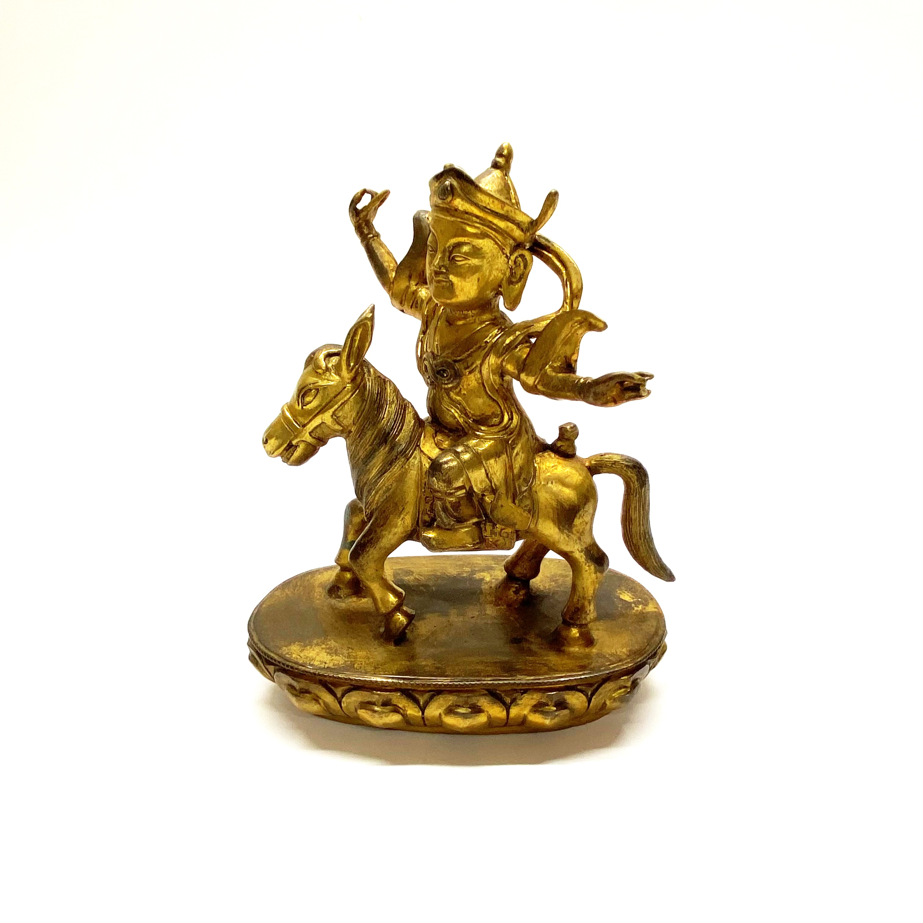 A Tibetan gilt bronze figure of Buddhist deity riding a pony H. 23cm - Image 2 of 3