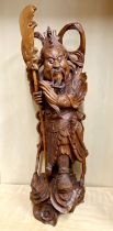 A large Chinese carved wooden figure with glass eyes H. 75cm