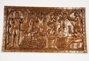 An Eastern carved hardwood panel, 41 x 71cm.