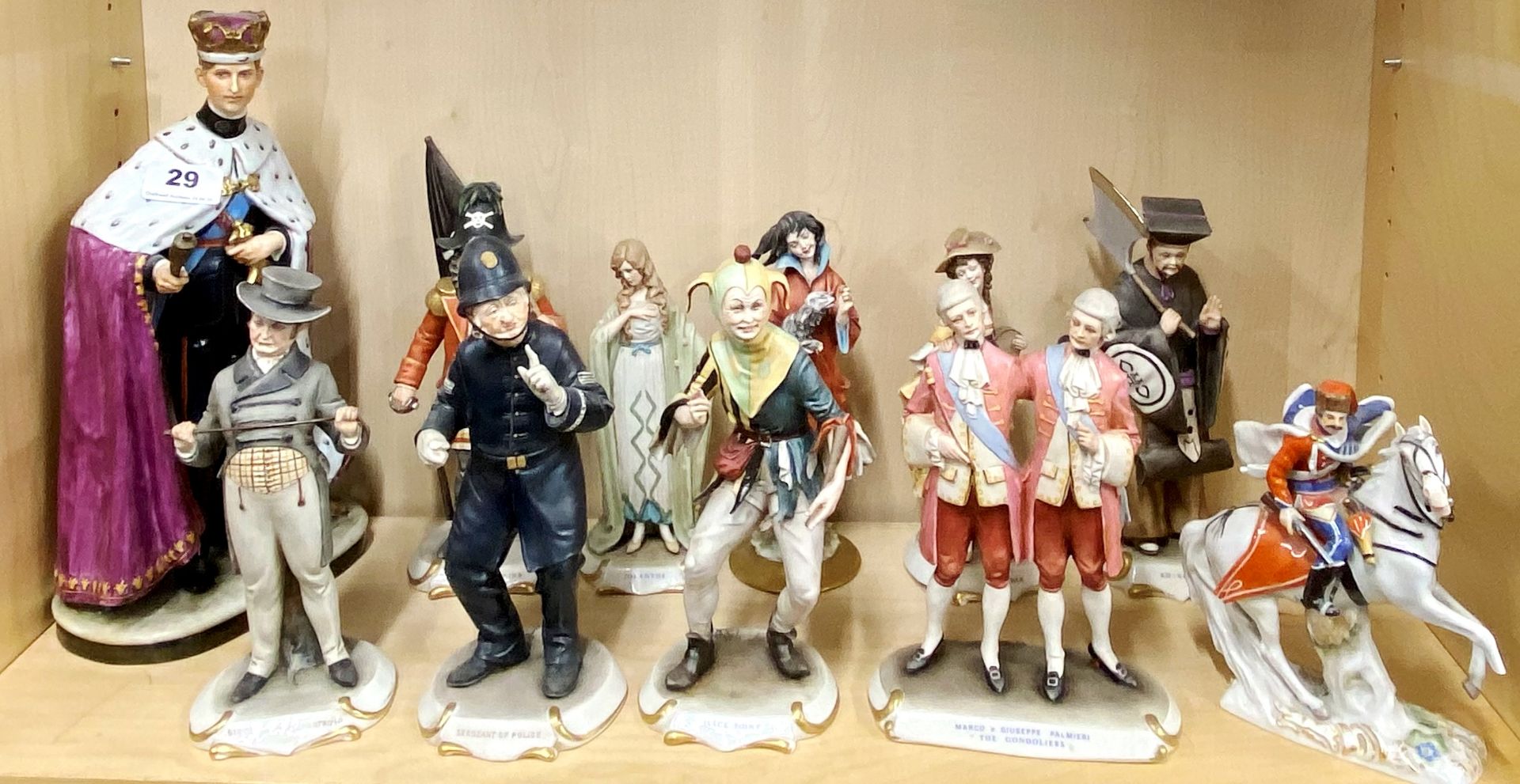 A group of Naples style porcelain figurines together with a continental porcelain figure of a