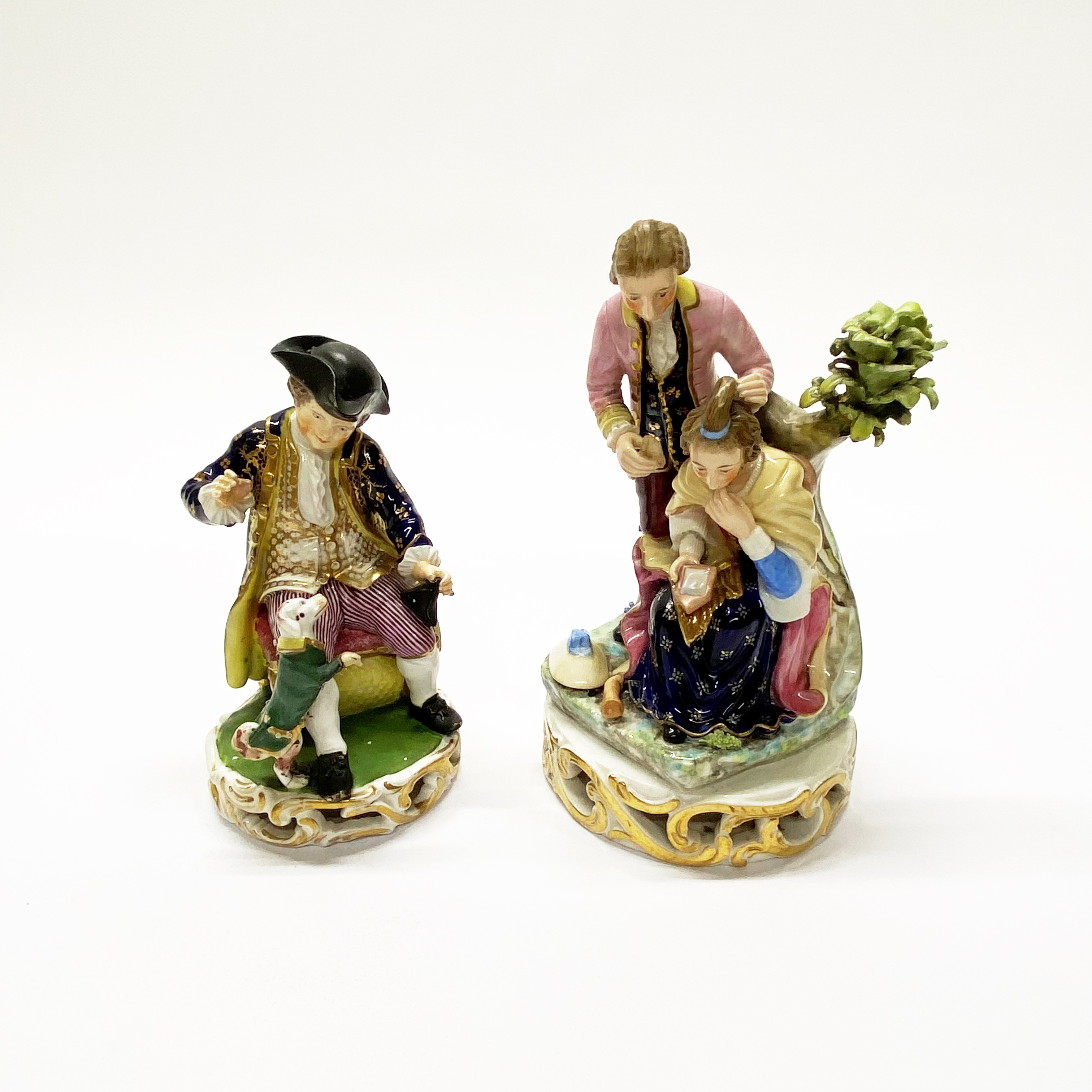 An early Bloor Derby porcelain figure of a boy with a performing dog together with Bloor Derby