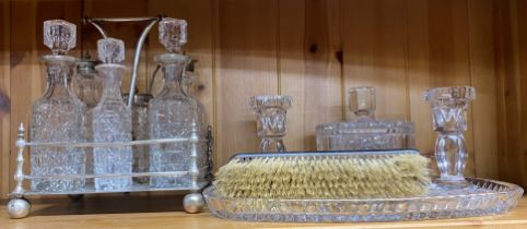 A silverplate and cut crystal cruet set and dressing table set.