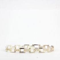 A hallmaked silver bracelet set with diamonds, L. 18cm.