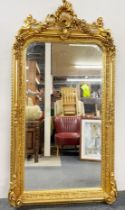 A large gilt framed cherub mirror W. 85cm x H. 162cm
