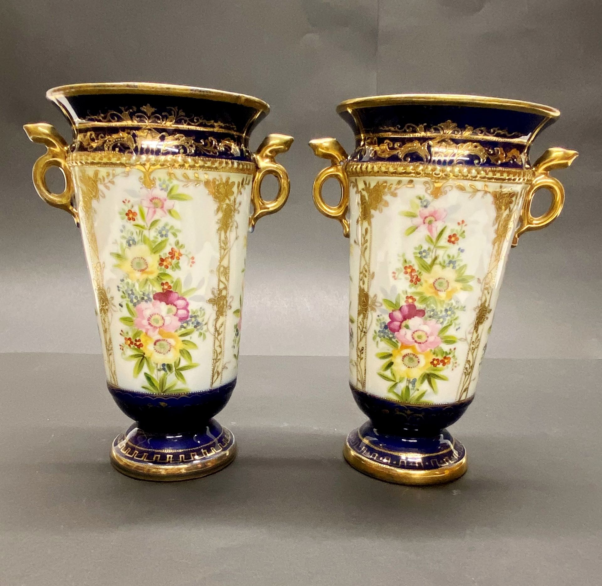 A pair of Japanese porcelain vases. H. 20cm. (Slight A/F)