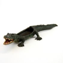 A Vienna style cold painted bronze crocodile pin cushion holder L. 27cm.