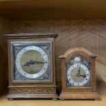 An oak cased mid 20thC mantle clock H. 17cm. Together with further oak cased clock.