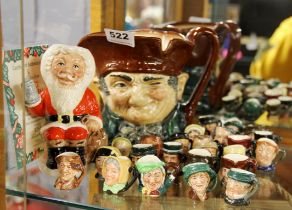 A collection of Royal Doulton miniature character jugs with limited edition 'Father Christmas' and