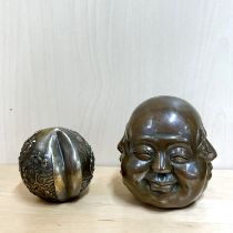 Two Chinese bronze paper weights, largest 12cm.