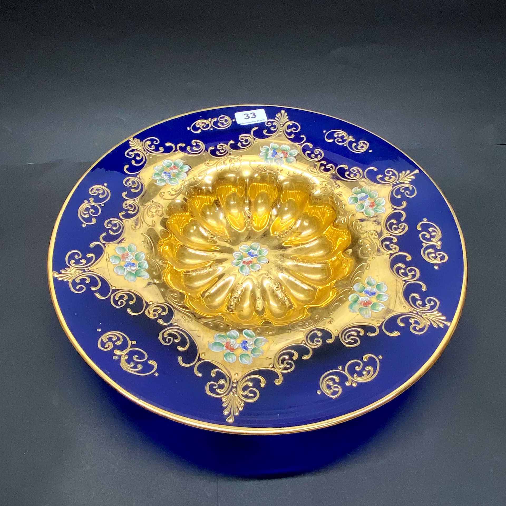 A large Venetian gilt glass bowl. Dia. 41cm with wall hanging disc on the reverse. Dia 41cm