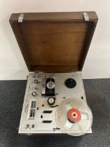 A vintage Akai reel to reel tape recorder.