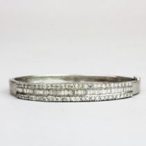 A stylish silver and white stone set bangle, internal dia. 6cm.