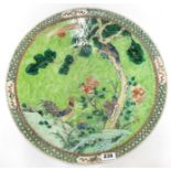 A large Chinese mid 20thC hand enamled porcelain charger Dia. 47cm.