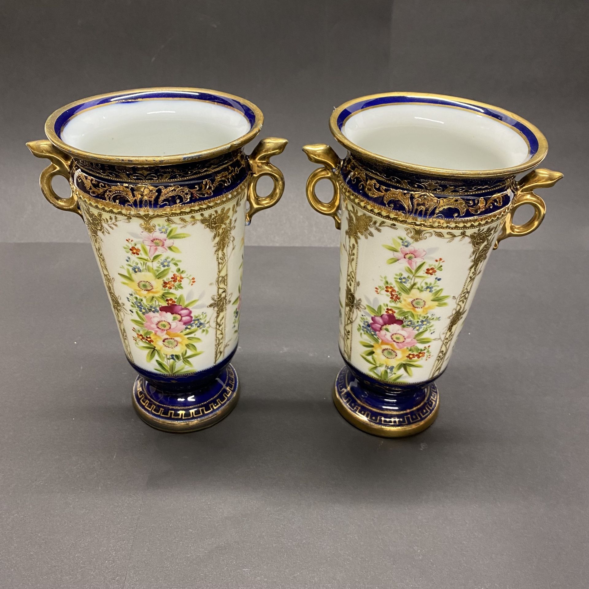 A pair of Japanese porcelain vases. H. 20cm. (Slight A/F) - Image 2 of 3