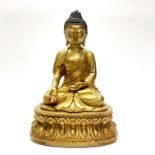 A Sino-Tibetan gilt bronze figure of a seated Buddha H. 38cm