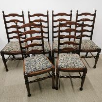 A set of six mahogany high back dining chairs with floral upholstered cushions, H. 102cm.
