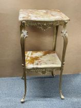 A 1970s oynx and brass two tiered side table size. 39cm x 39cm x 76cm.