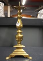 A brass pricket candlestick, H. 38cm.