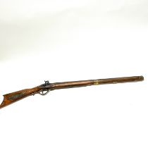 A vintage wood and metal replica of a percussion rifle with working dry fire action L. 114cm.