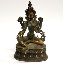 A Tibetan gilt bronze and jewelled figure of a seated Tara, H. 22cm.