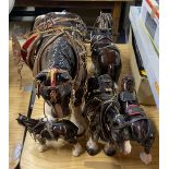 A very large ceramic shire horse, H. 45cm. Together with three others and a cart.