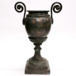 A classical style hammered bronze urn, H. 39cm.