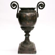 A classical style hammered bronze urn, H. 39cm.