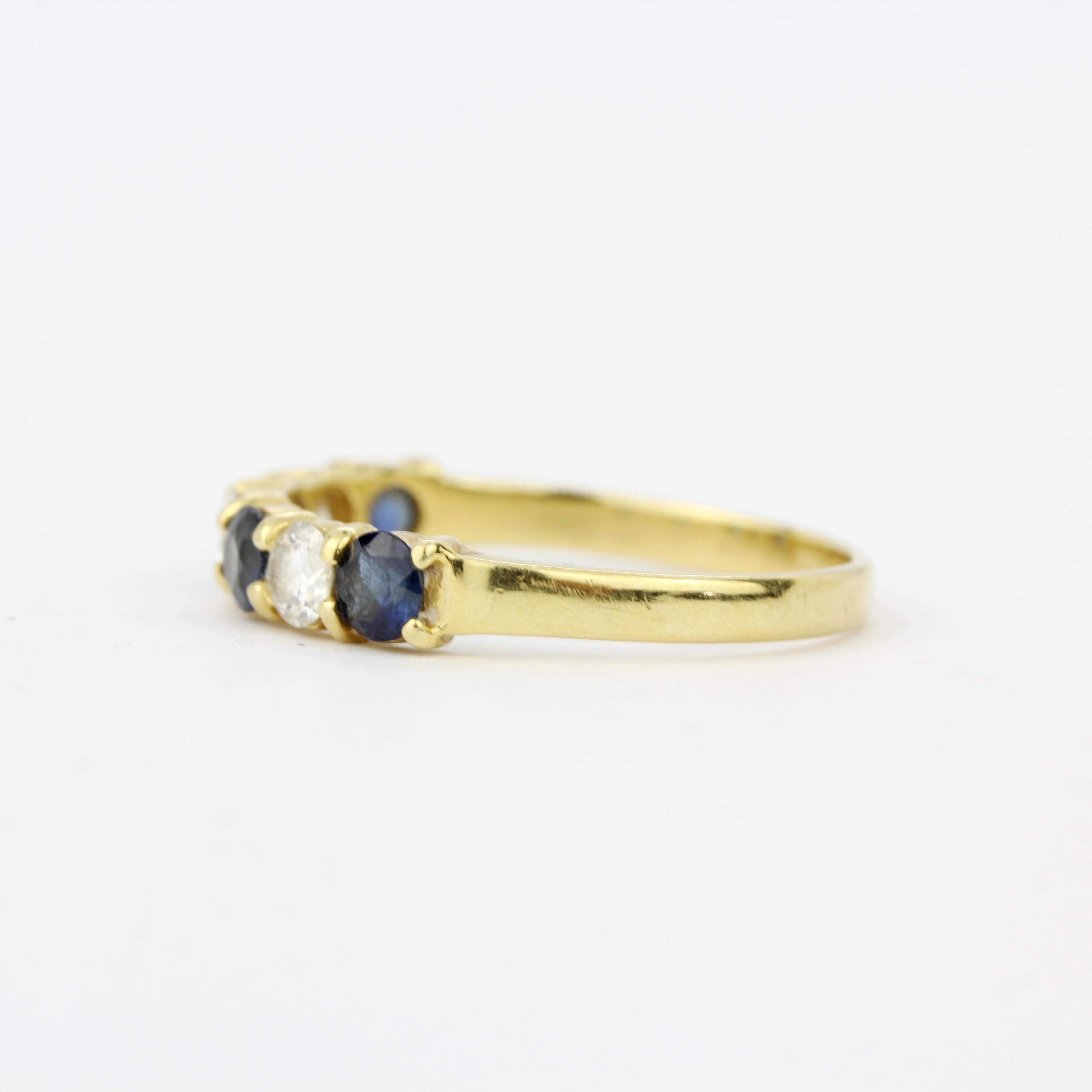 A 9ct yellow gold (tested,, worn hallmark) sapphire and diamond half eternity ring, approx. 0. - Image 3 of 3