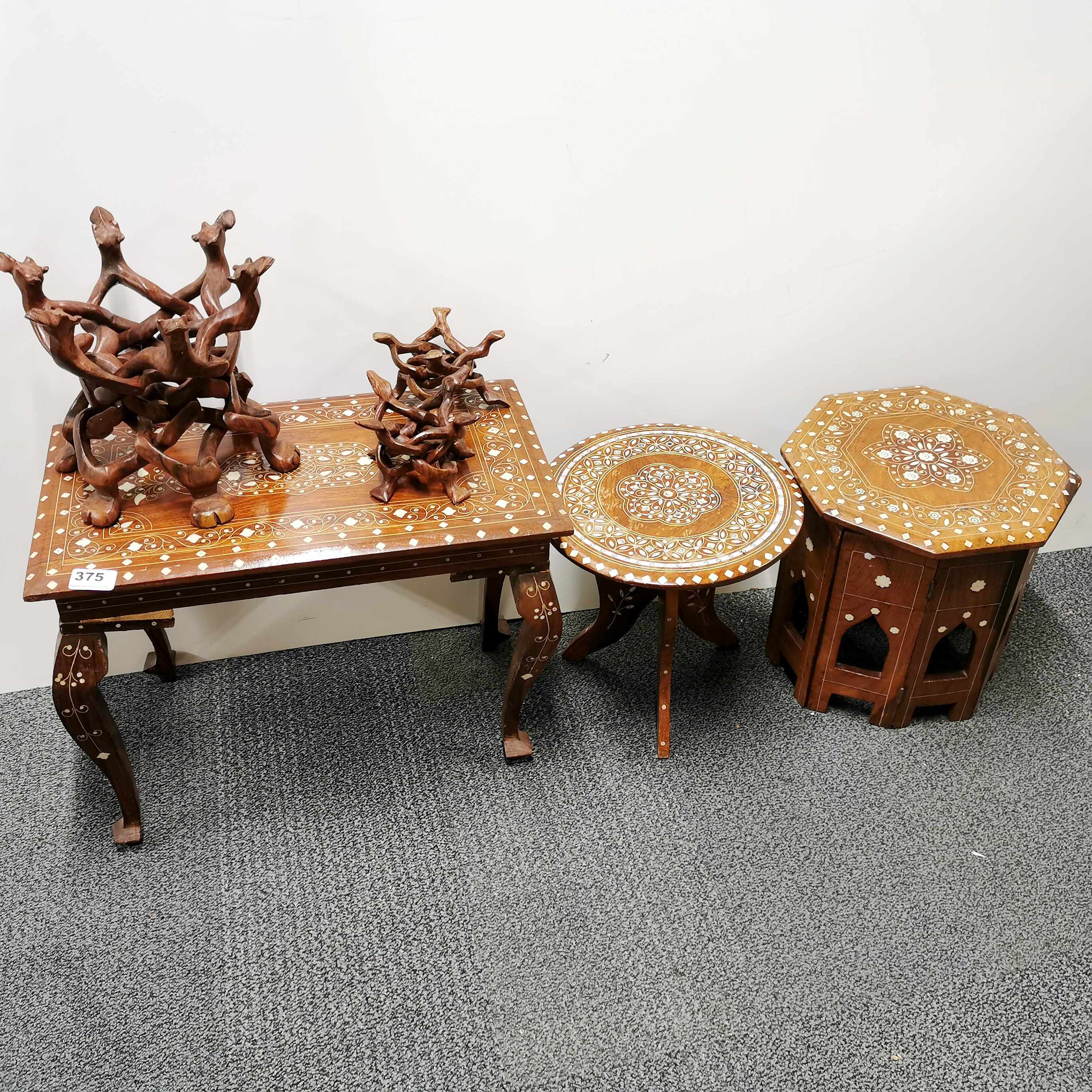 A group of Indian inlaid tables and puzzle bowl stands, largest table 30 x 50 x 38cm.