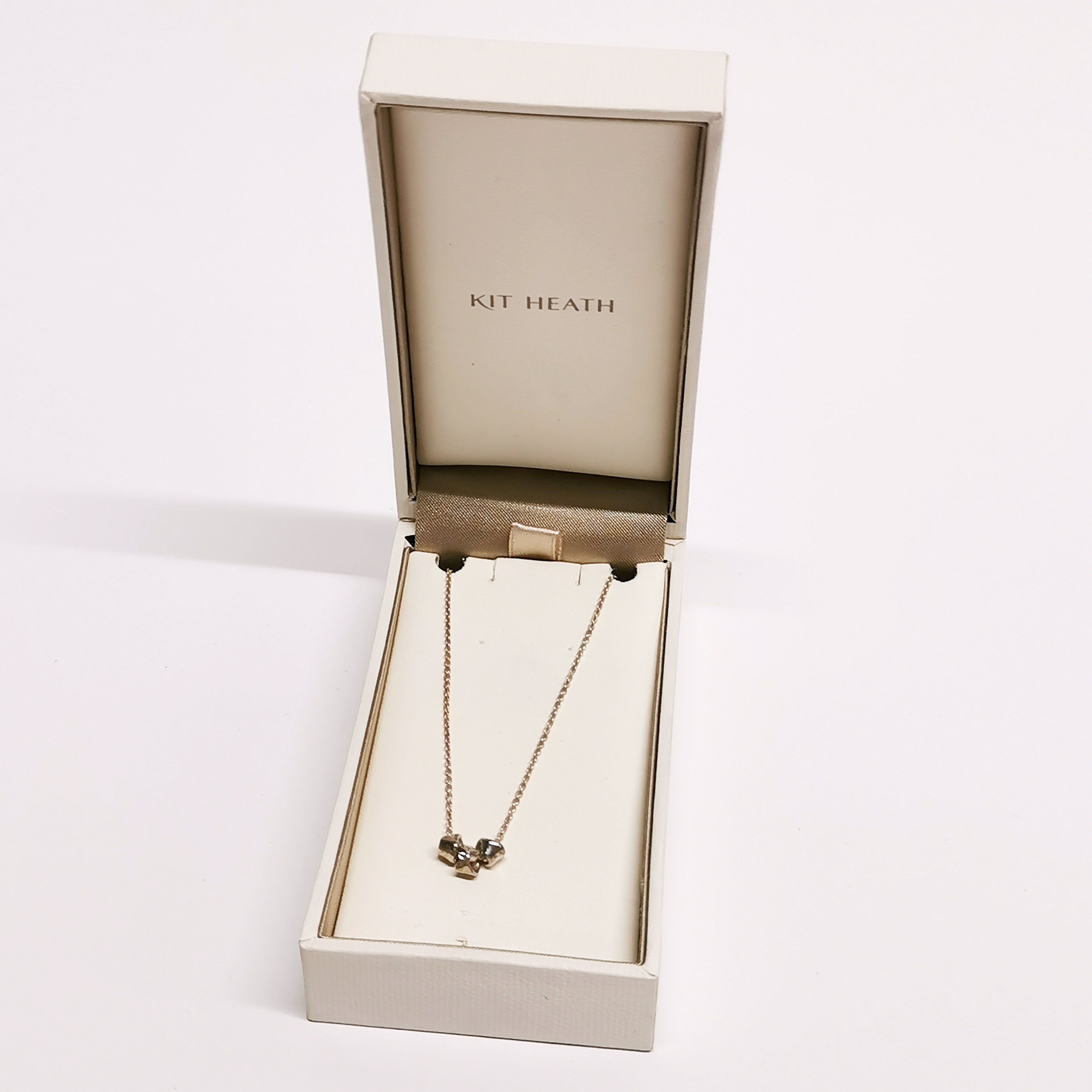 A boxed silver Kit Heath necklace.