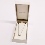 A boxed silver Kit Heath necklace.