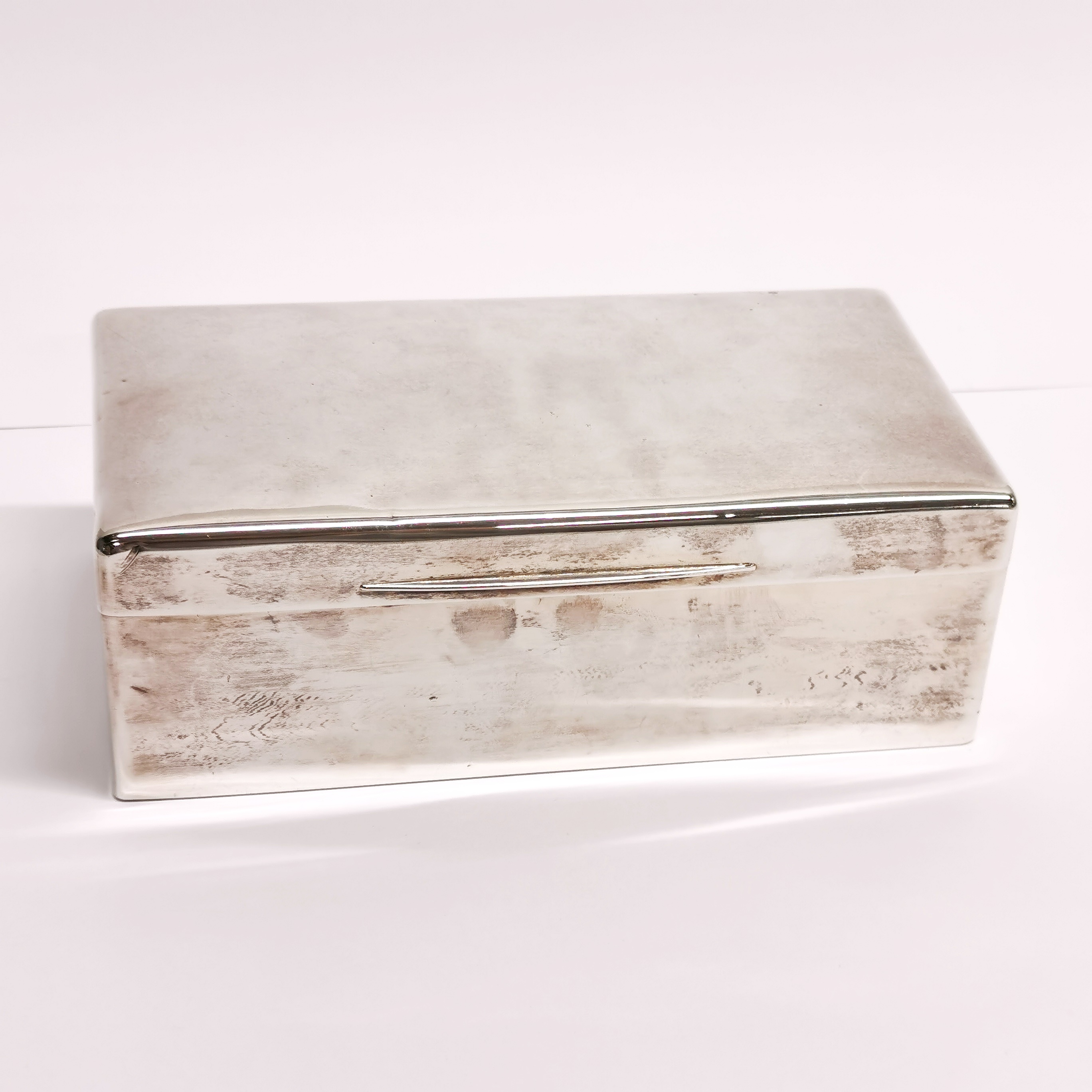 A large hallmarked silver cigarette box, 20 x 11 x 7cm.