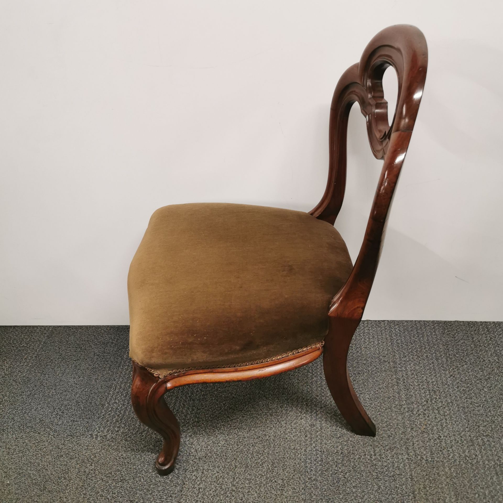 A pair of 19thC carved mahogany hall chairs. - Image 2 of 2