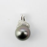 A 9t white gold pendant set with a black Tahitian pearl and diamonds, L. 5.6cm.