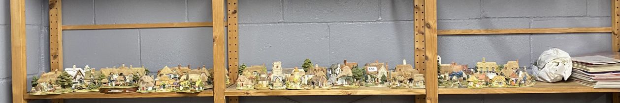 An extensive collection of Lilliput Lane houses, with boxes and collector's magazines.
