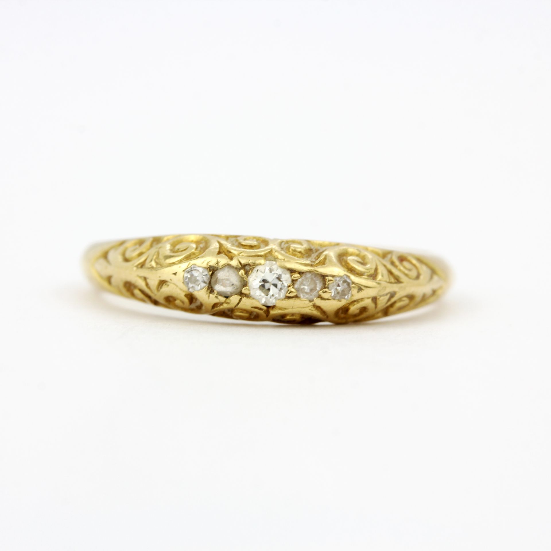 An antique 18ct yellow gold ring set with rose cut diamonds, ring size P.