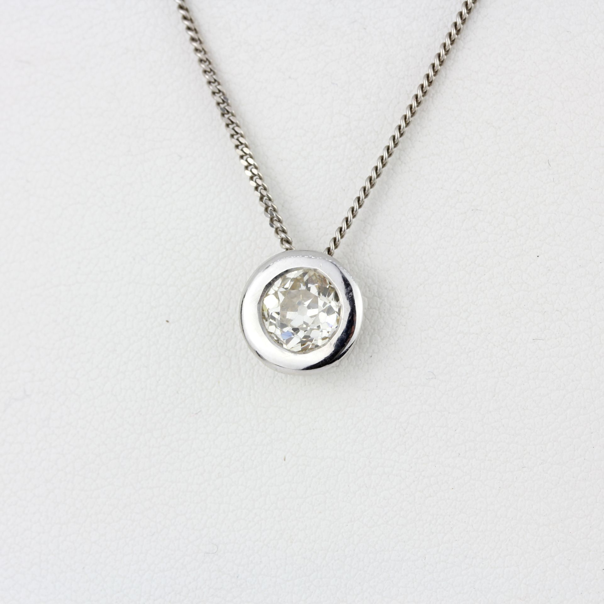 An 18ct white gold pendant set with and old brilliant cut diamond, approx. 0.90ct, clarity VS,