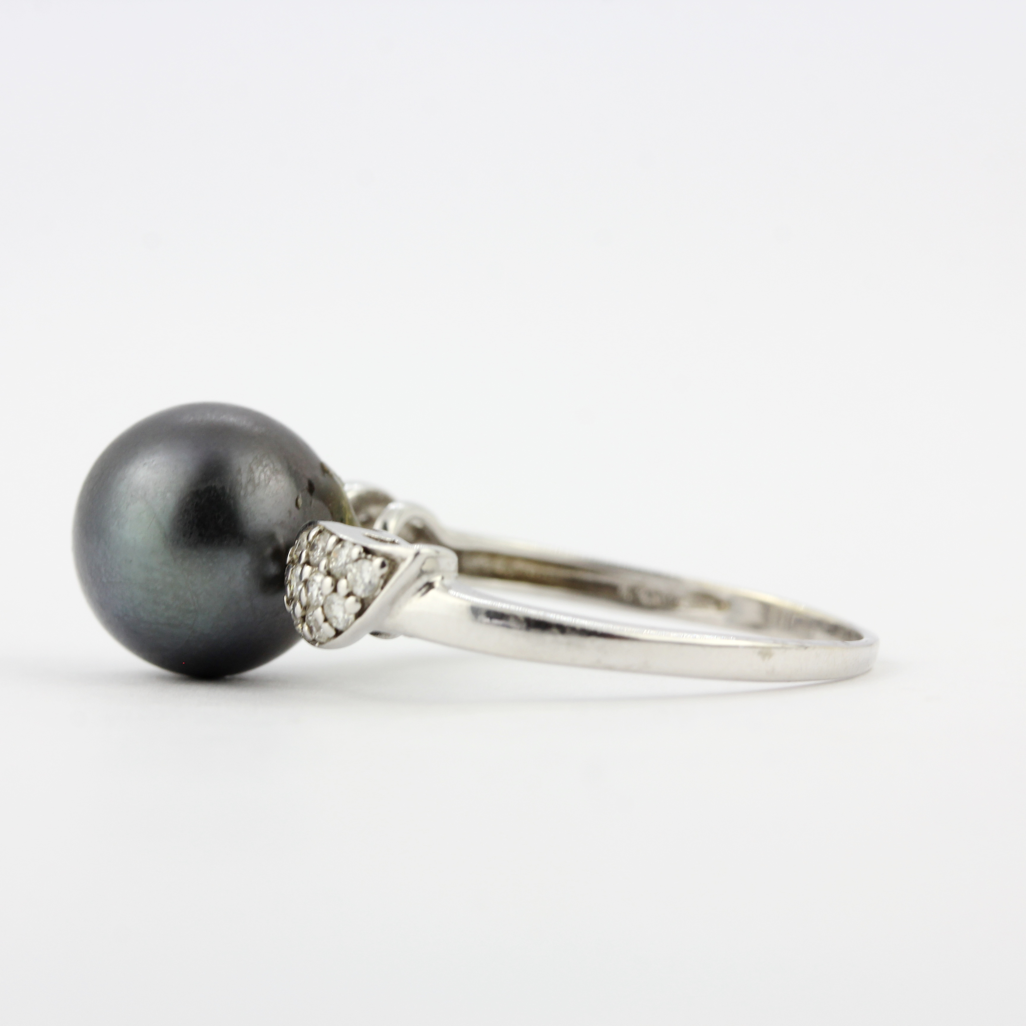 A 9ct white gold ring set with a black Tahitian pearl and diamond set shoulders, ring size S.5. - Image 2 of 3