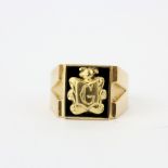 A yellow metal (tested 14ct gold) enamelled signet ring, ring size X.