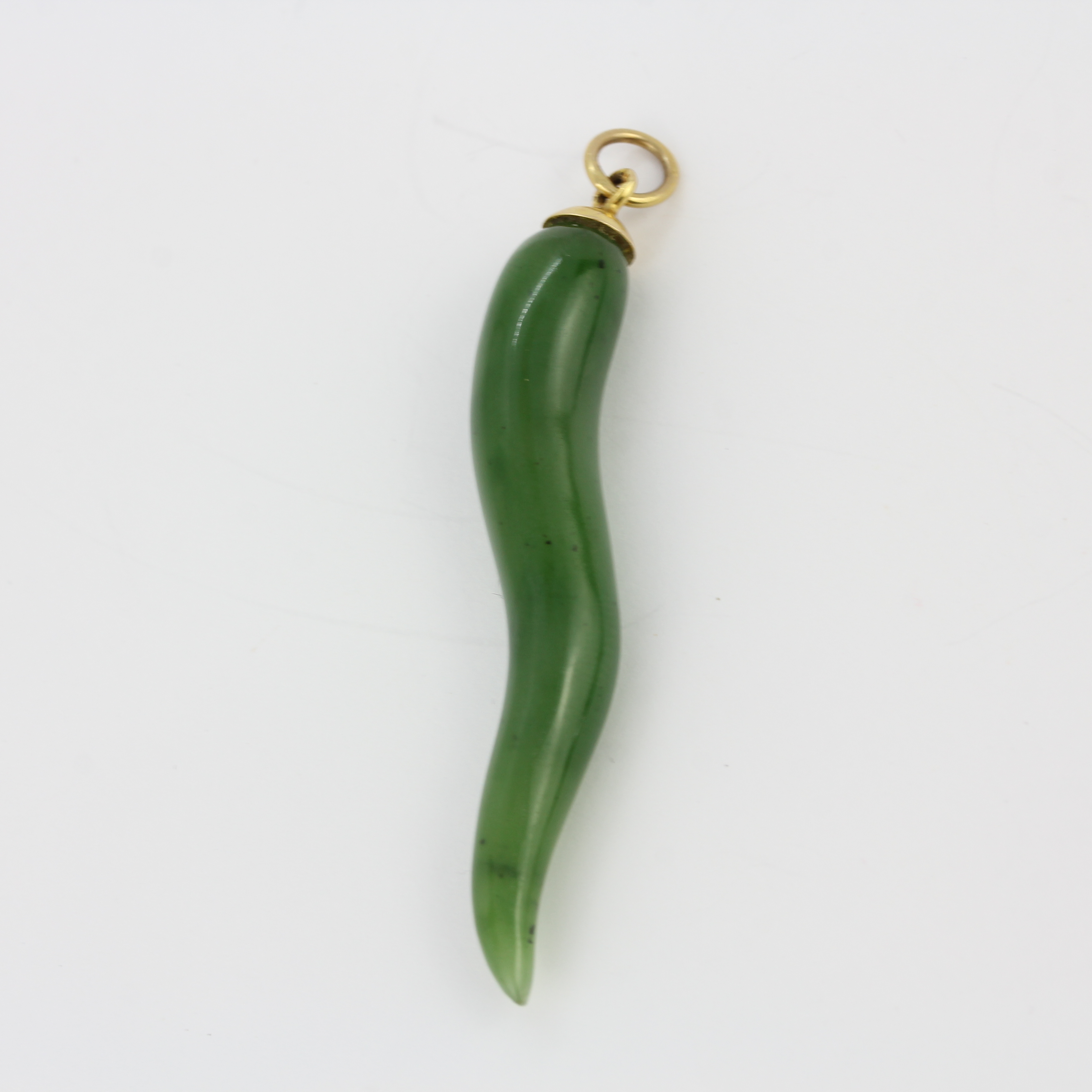 A 9ct yellow gold mounted jade pendant, L. 5.5cm.