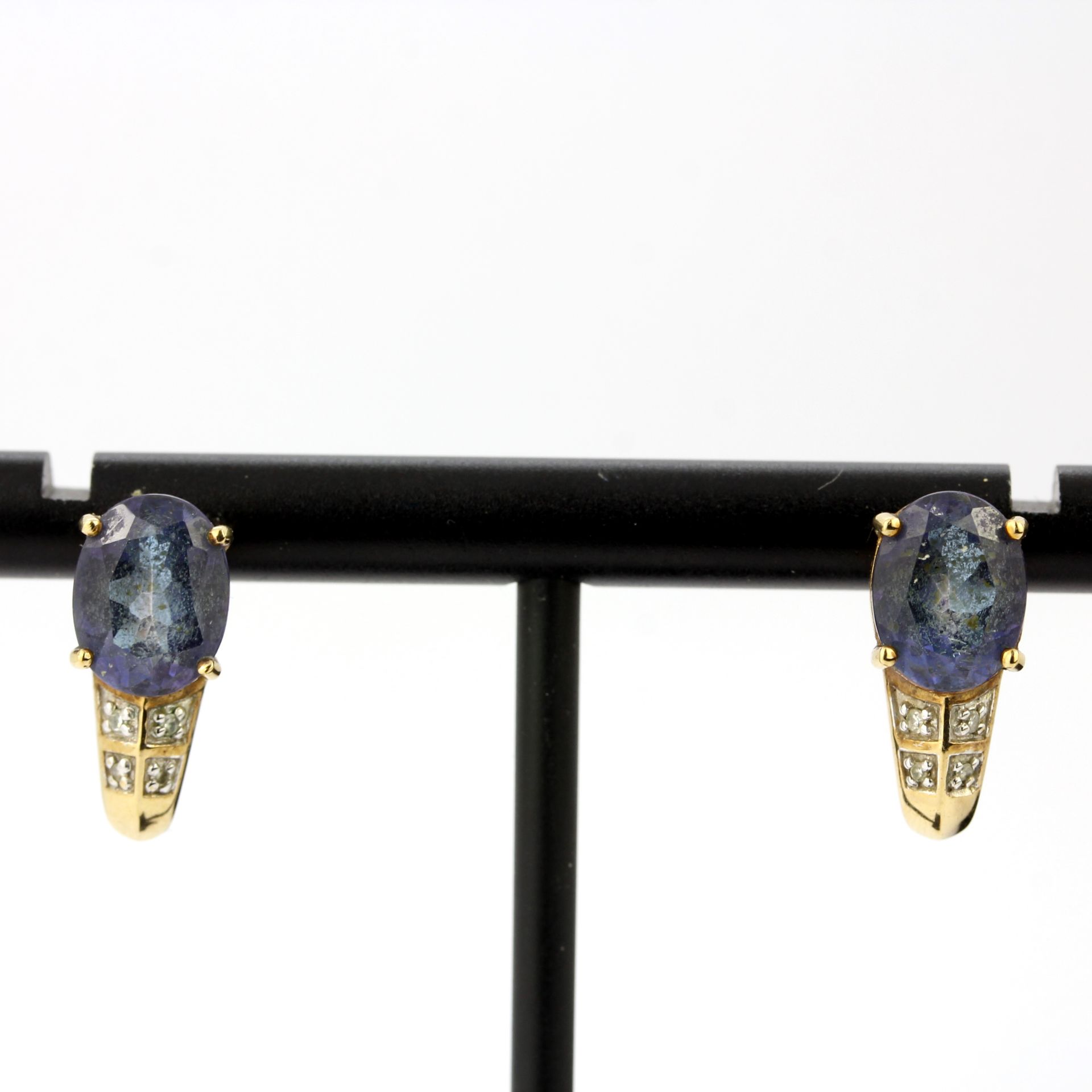A pair of 9ct yellow gold earrings set with blue topaz and diamonds, L. 1.4cm.