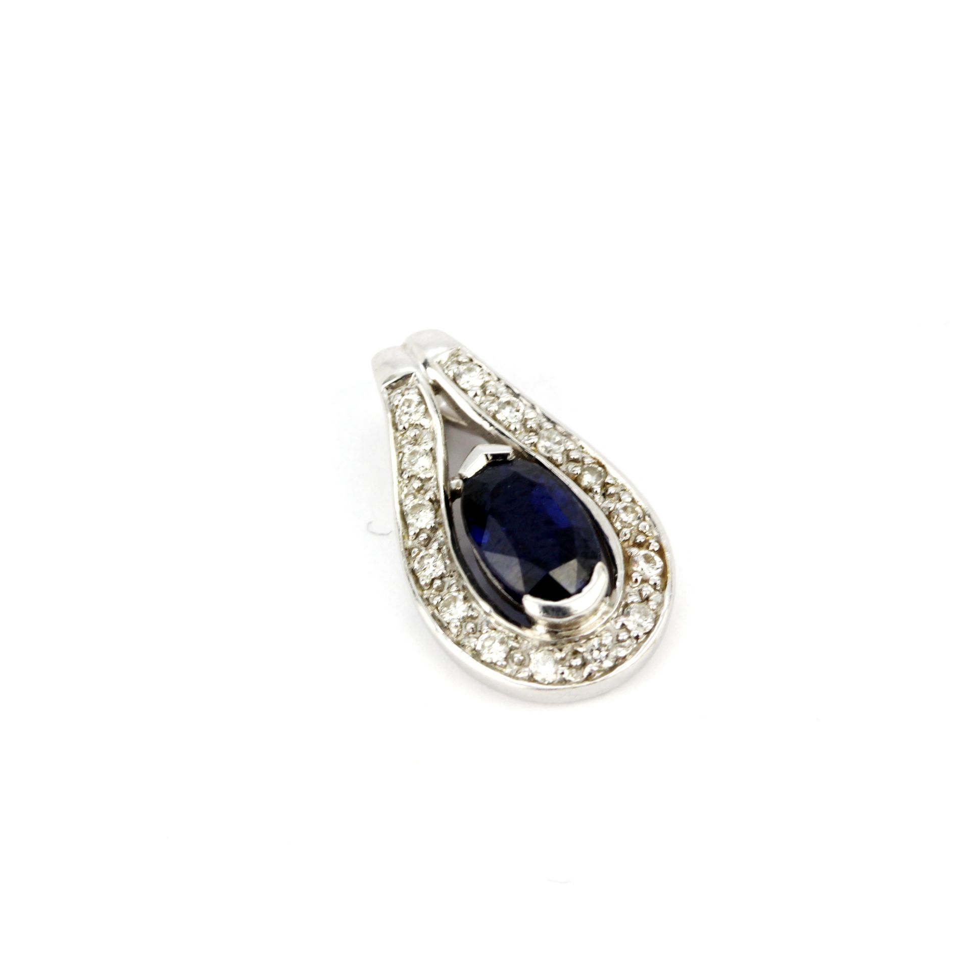 An 18ct white gold pendant set with an oval cut sapphire surrounded by diamonds, L. 1.5cm. - Image 3 of 3
