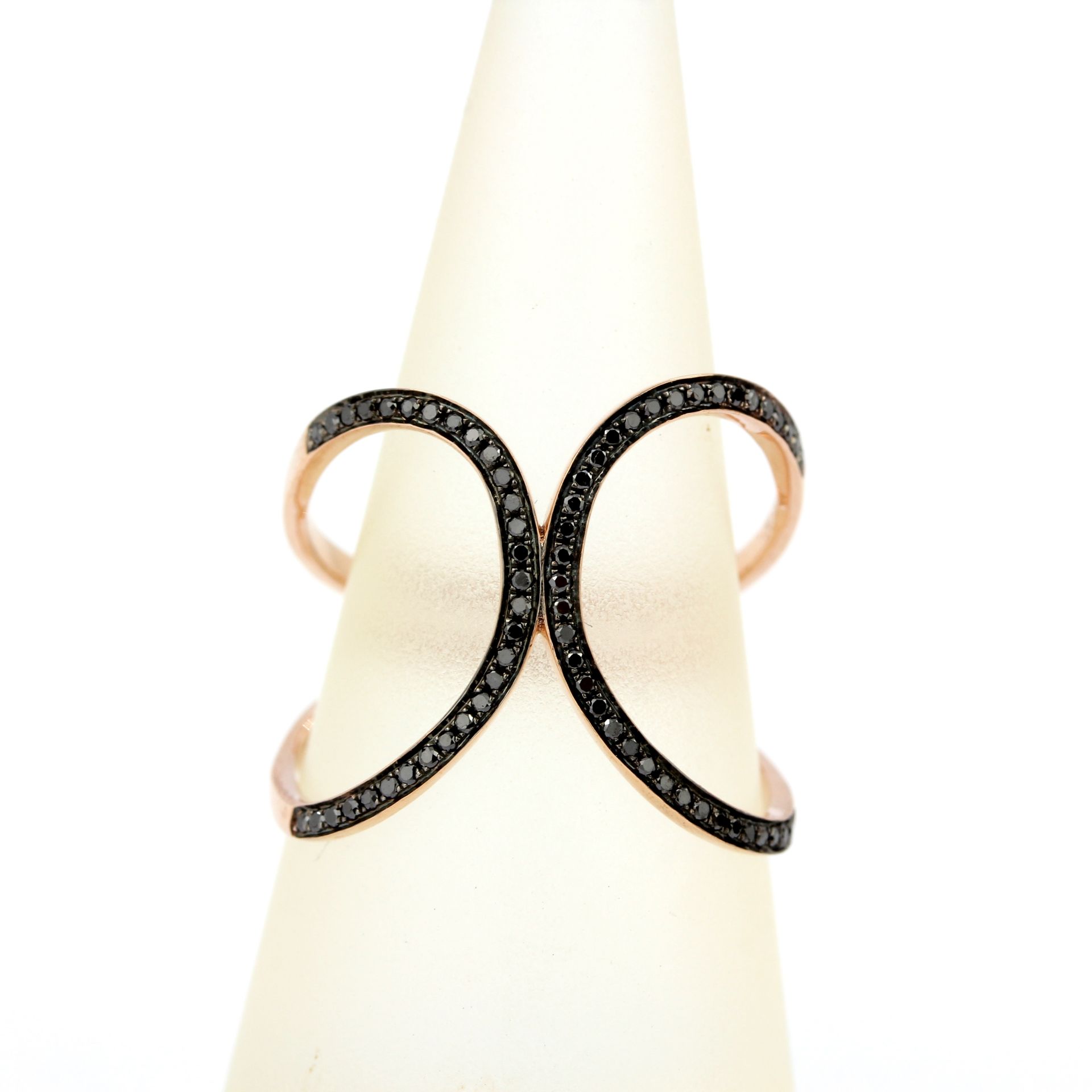 A 9ct rose gold ring set with brilliant cut fancy black diamonds, ring size P.5.